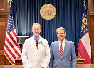 OrthoAtlanta orthopedic surgeon, Todd A. Schmidt, MD, and Governor Brian Kemp at the state capitol in Georgia